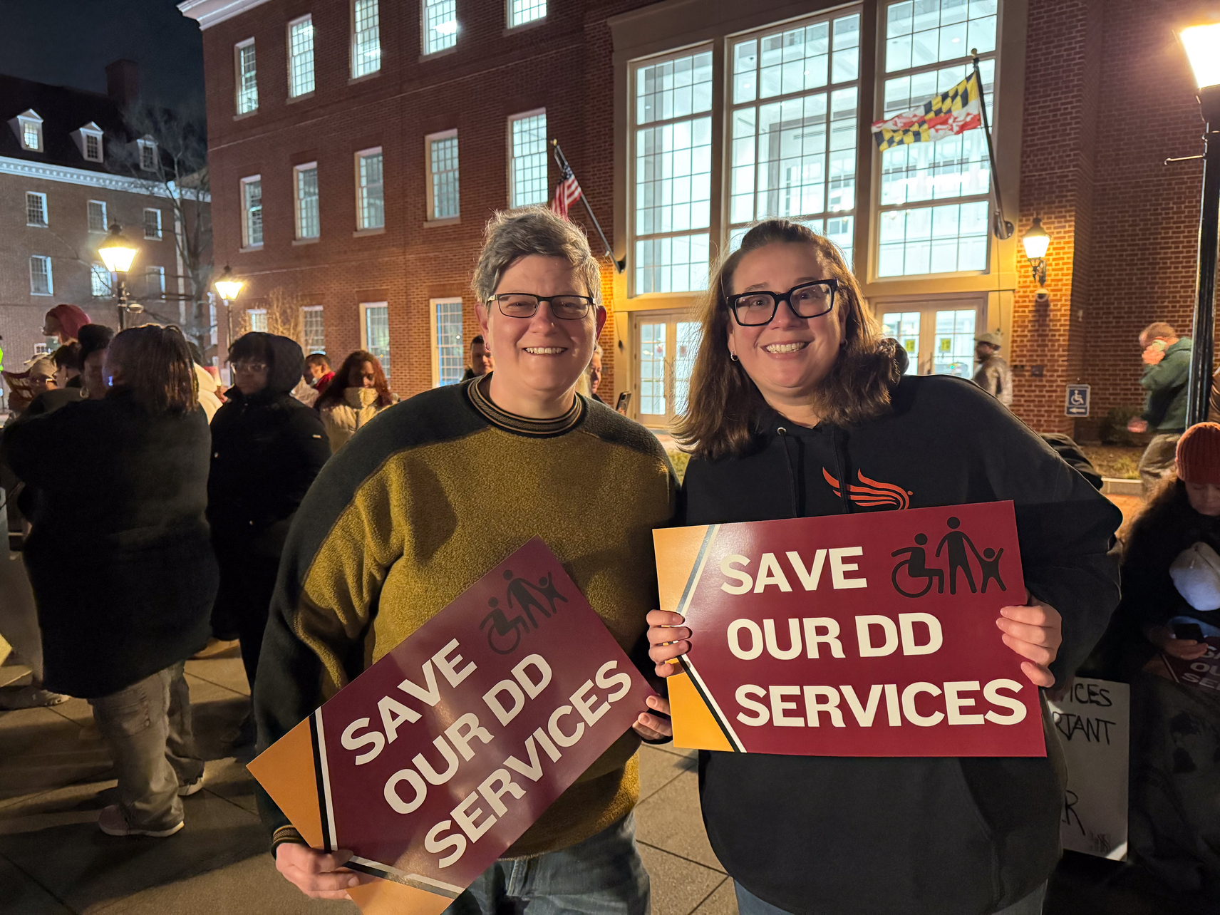 Advocates carrying signs that say
