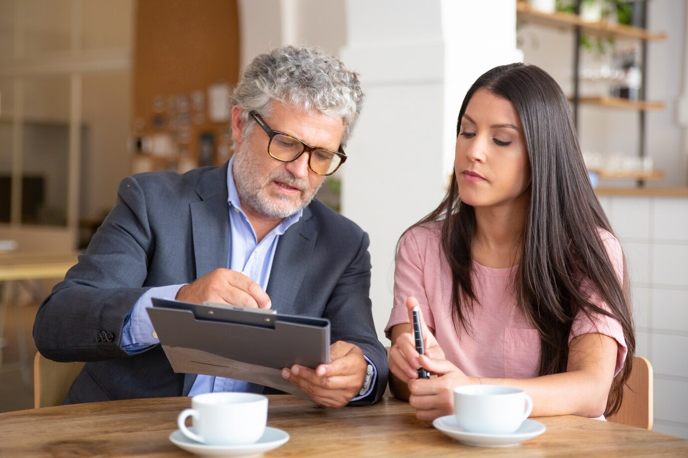 https://stratus.campaign-image.com/images/1299610000248875970_zc_v1_1730833685850_confident_paper_expert_reading_analyzing_explaining_document_female_customer_74855_9749.jpg