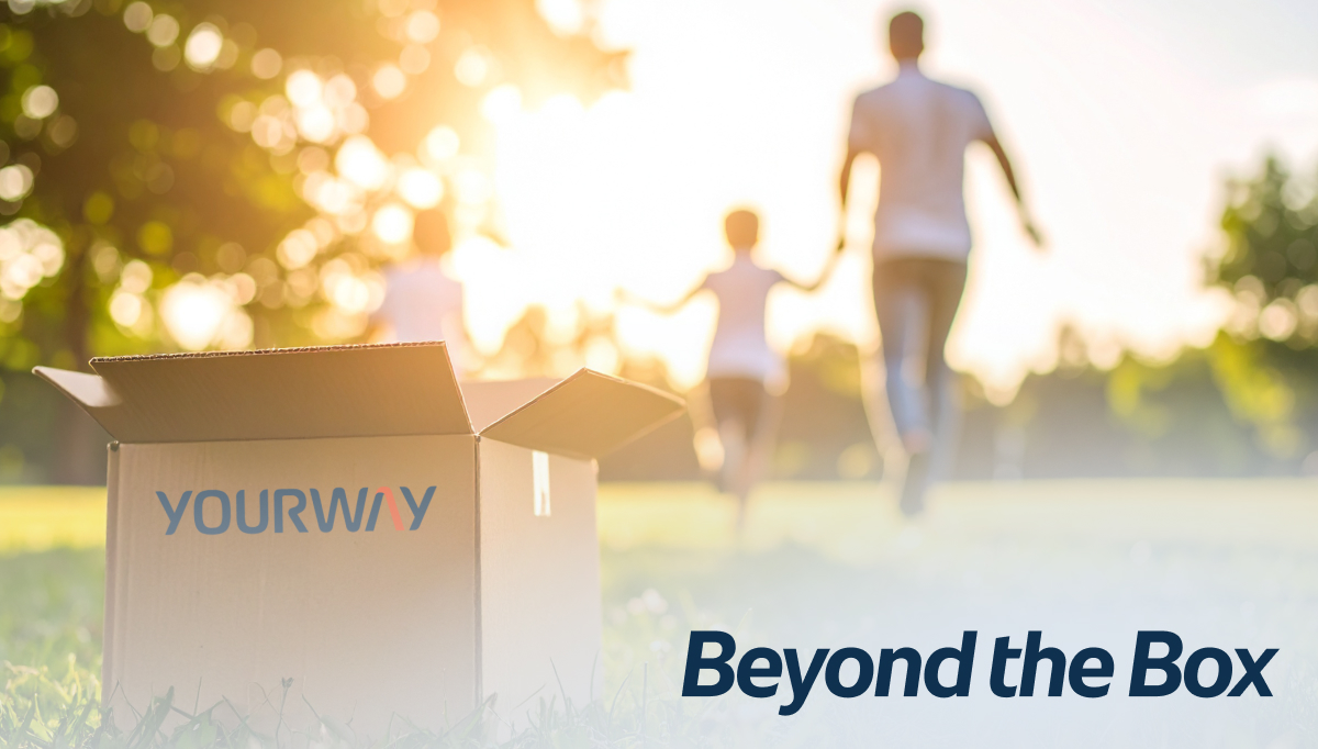 Open Yourway shipping box in the foreground with a family walking away in soft focus, symbolizing logistics that support real patient outcomes beyond delivery.