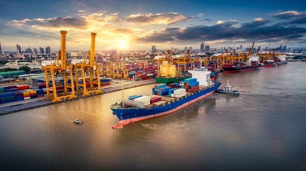 Image of a large container ship near a harbour