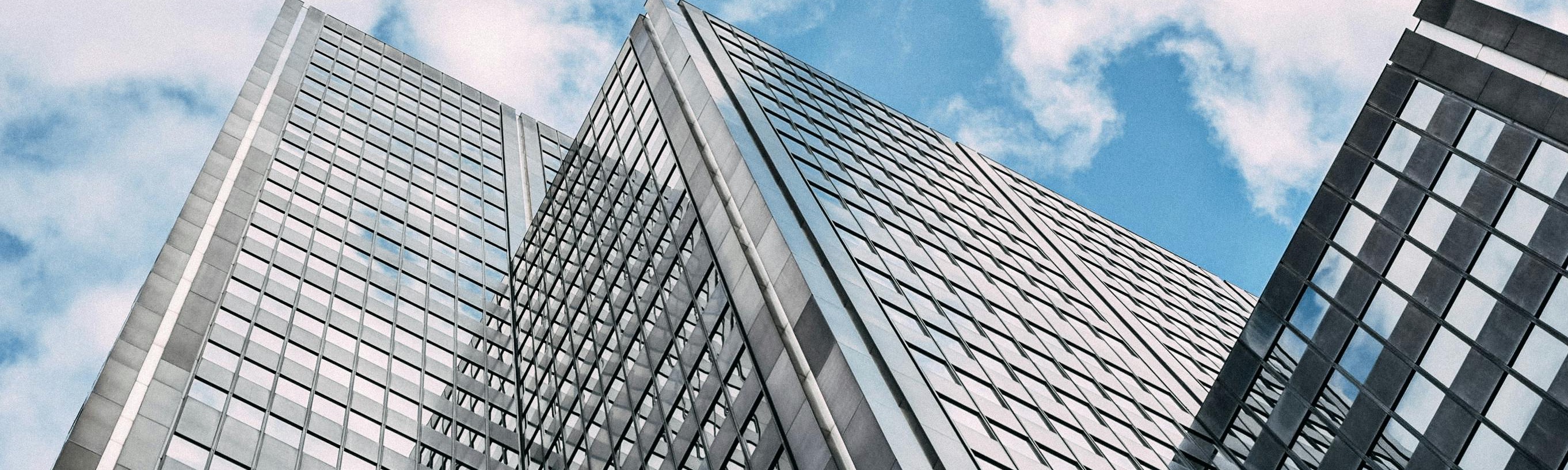 office towers against blue sky and clouds
