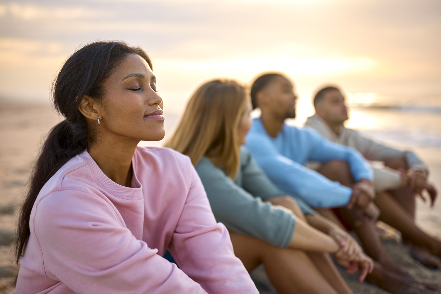 Woman Enjoying the moment on a beach with friends.