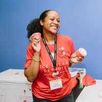 Owner of Ice Cream Detroit smiling and holding her product at the Spring 2022 RBC Showcase