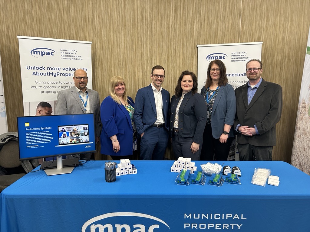photo of MPAC team behind exhibitor booth