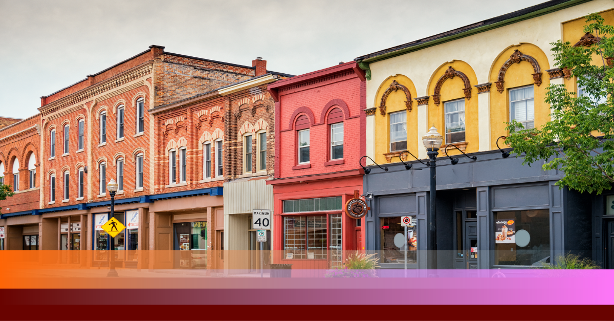 Photo of colourful brick buildings in a historic downtown business area.