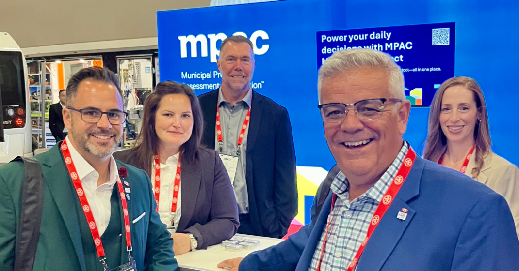 Photo of MPAC Municipal and Stakeholder Relations team members with municipal partners from the Town of Bradford West Gwillimbury at the MPAC booth during the 2025 AMO Conference.