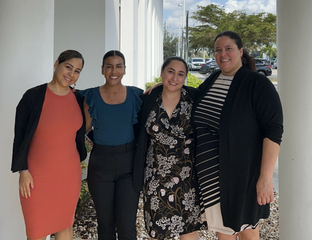 Fort Myers Eastern staff in front of the new office